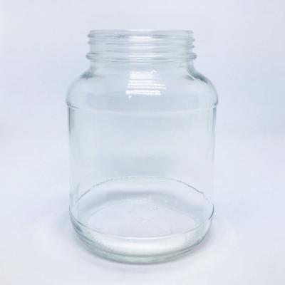 China Wholesale Cylinder Glass Bottle 830ml Honey Pickle Sauce Glass Jar Food Jam Jar for sale