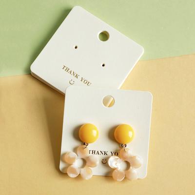 China Earrings Shows Jewelry Display Card Pure White Hole Embossed Earring Necklace Display Card for sale