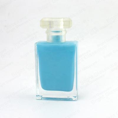 China Personal Care 30ml Glass Perfume Bottle Spray Square Shape Glass Blue Perfume Bottle With Round Cap for sale