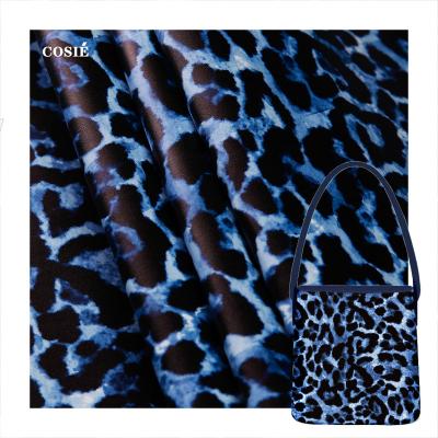 China Waterproof Blue Leopard Print Pattern Leather Heavyweight 595gsm Customize Waterproof Faux Roll Digital Printing Leather Wallet for sale