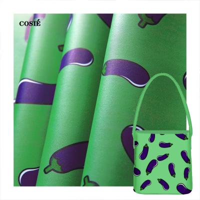 China Low Moq Waterproof Designer Pattern Eggplants On A Green Background Print Faux Leather Customized Any Weight PU Fabric For Backpack for sale