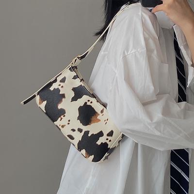 China Purpose cow design armpit multifunctional handbag for women new edition style Korean soft French shoulder cross-launched bag for sale