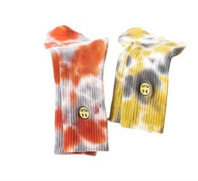 China Breathable Sports Tie Dye Embroidered Smiling Face Socks Medium Tube Socks For Men And Women Socks for sale