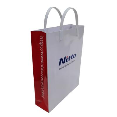 China Recyclable Custom White Gold Foil Paper Cardboard Gift Bag Touch Lamination Cardboard Packaging Bags for sale