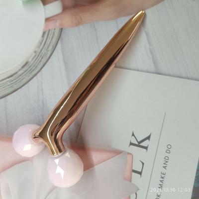 China The best-selling 3D double rollers rose quartz jade roller beauty massager zinc alloy roller for face for sale