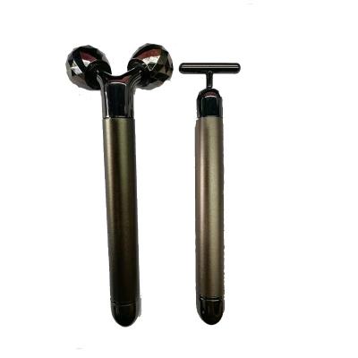 China Dual Rollers Shape Design Massage Roller Equipment Face 24k Gold Energy Beauty Bar Vibration Facial Massager for sale