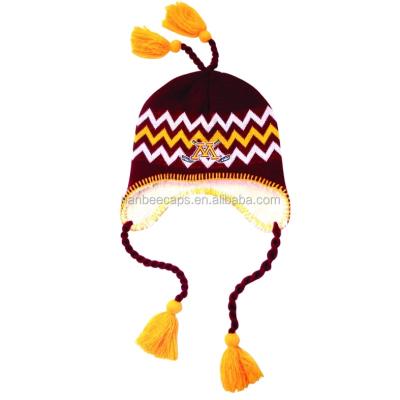 China JOINT Custom Warm Hat Pompom Ear Flaps Beanies Knitted Hat With Tassels for sale