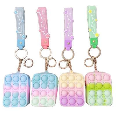 China Fashion Cartoon Portable Silicone Unzip Pocket Fruit Bubble Music Wallet Rat Killer Bag Key Chain Gift For Girls for sale