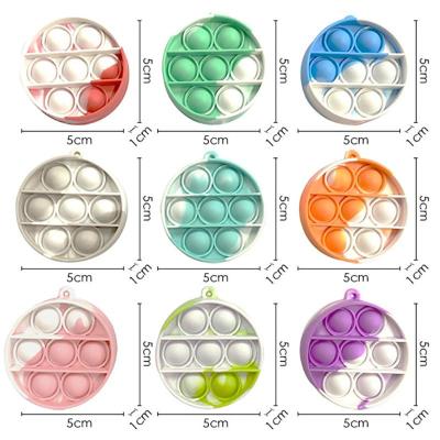 China 2021 Promotion Gifts Link Dye Rainbow Simple Mini Silicone Squeeze Popping Dimple Bubble Fidget Toy Dinasour Key Chain for sale