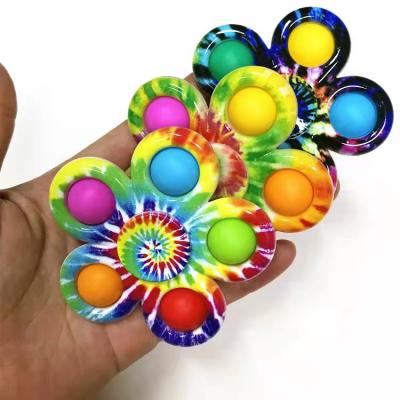 China Effort Release Toy Infant Hand Grasping Pressing Funny Bubble 3D Animated Flying Person Spinner Flower Spinner Pack Snap Toy for sale