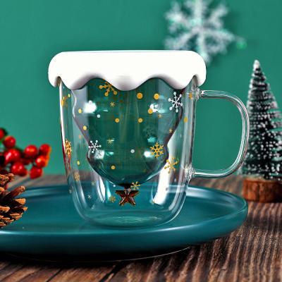 China Hopside Christmas Tree Sustainable Gift Set Christmas Fancy Transparent Double Wall Glass Mugs With Lid for sale