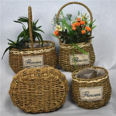 China Plant Fiber Plant Fiber Weaving Basket Portable Hand Held Straw Flower Flower Pot for sale