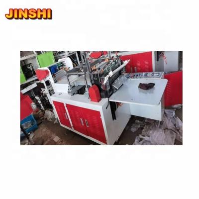 China Automatic Automated Double Layers Tape Plastic Gloves Of Hotels Making Machine (JINSHI COMPANY) for sale