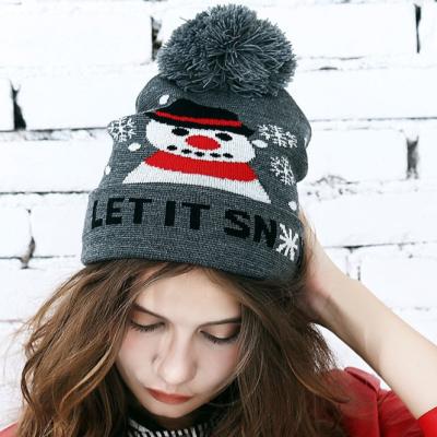 China COMMON 2019 new design pom pom winter hat hot sale woman knitted cuffed beanie hat with jacquard pattern for sale