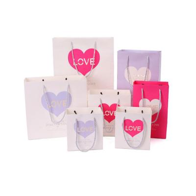 China Fancy Paper Recyclable Paper Gift Material Industrial Use And Gift Bag With Handles for sale