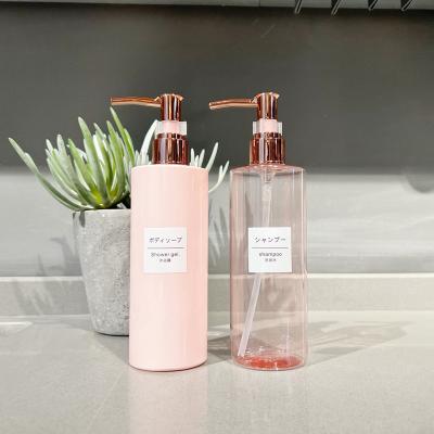 China Cosmetic Pink Squeeze Lotion Bottle , Flat Shoulder Plastic Cylindrical Empty Bottle for sale