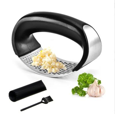 China Stainless Steel Garlic Grinder Kitchen Viable Garlic Crusher Manual Annular Garlic Crusher for sale