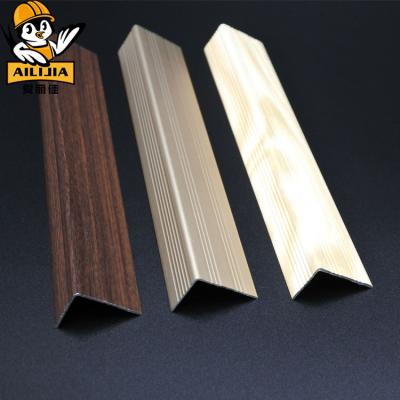 China Minimalist Wood Grain Metal Floors Anti-Slip Aluminum Laminate Stair Nosing With Ceramic Tile for sale