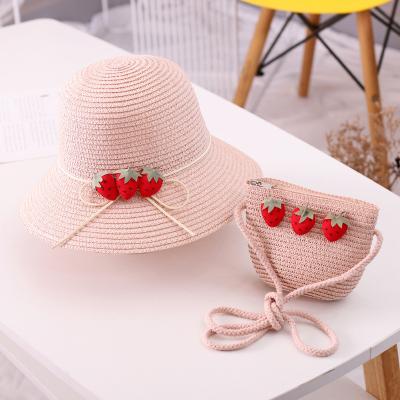 China Natural Grass Women Kids Sun Flower Handbags Sunscreen Straw Hat Bags for sale