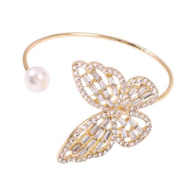 China Trendy Fashion Wedding Gold Plated Rhinestone Pearl Cuff Bangle Gemstone Butterfly Bracelet For Women for sale