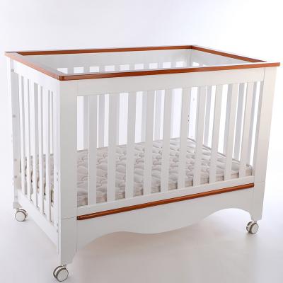 China Simplicity Modern Excellent Multifunctional Wooden Material Baby Bed Infant Crib Bed with Casters Baby Cradle with Adjustable Bed Board for sale