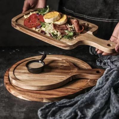 China Sustainable Natural solid wood pizza plate Pizza board Custom sized pine wood Picnic Meat cutting board pizza serving boards for sale