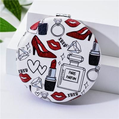 China Mini Handheld Cute Round Shape Lighted Handheld Makeup Mirror Pocket Travel Beauty Vanity Mirror for sale