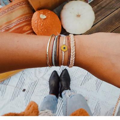 China 2022 Hot Selling Bohemian Red Beaded Bohemian 5 Woven Daisy Colorful Leather Rope Bracelet Women's Piece Bracelet for sale