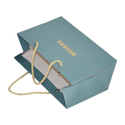 China Customized Recyclable White Paper Bags Cardboard Gift Bag With Handles For Wedding Shopping And Clothing Gift Bag for sale