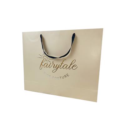 China Custom Logo Fancy Design Folding Biodegradable Stylish Recyclable Bag Custom Craft Printing Kraft Paper Bag for sale