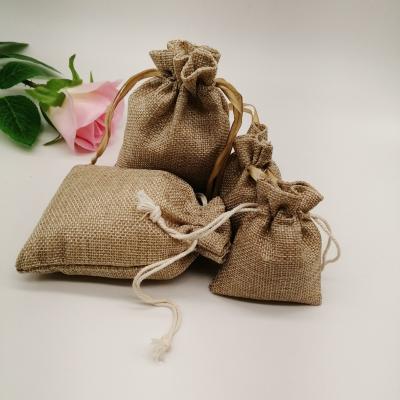 China Durable Natural Burlap Sack Gift Bag Natural Canvas Drawstring Bags With Handles Gift Favor Candy Bags for sale