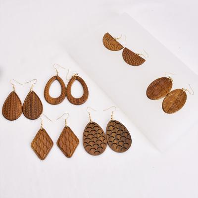 China FASHIONABLE wooden earrings pure natural color carved leopard pattern cavity female earrings for sale