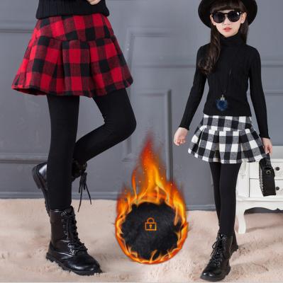 China Anti-static girls' winter skirt pants hot sale children's clothing pantskirt new style children's gaiters children's plaid culottes for sale