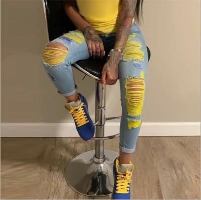 China Amazon eBay Breathable Wish New Style Street Fashion Pants Women's Jeans With Holes In Colors Light Color for sale