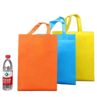 China Stock Package Handled Reusable Nonwoven Tote Bags, Chengbai Medium Size 100 Carry Bag Non Woven Fabric for sale