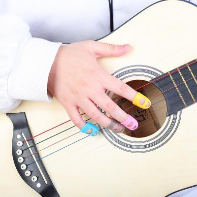 China Wholesale Price Guitar Four-color Protectors Fingertip Silicone Guards 4pcs/set Plucked Instrument Accessories for sale