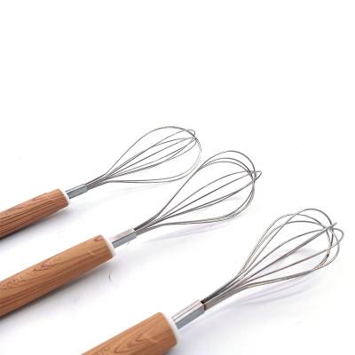 China Sustainable Food Grade Stainless Steel Egg Beater Egg Beater With Wooden Handle for sale