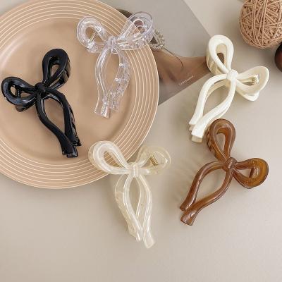 China Hair accessories Korean Ins Fashion Large Size Hair Accessories Glitter Plastic Bow Knot Hair Claw Clips For Woman Girls Thick Hair for sale