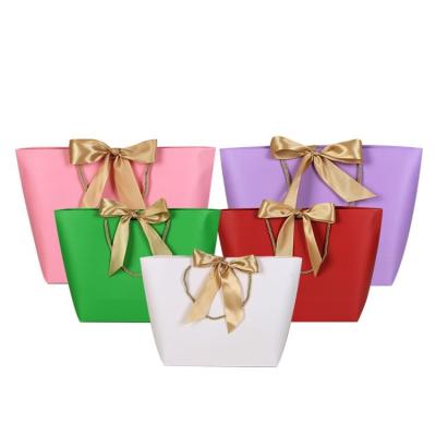 China Biodegradable Custom Logo Print Luxury Packaging Shopping Gift Paper Bag Jewelry Bag with Handle and Ribbon for Apparel and Jewelry for sale