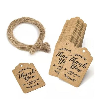 China Sustainable Recycled Printed Brown Kraft Paper Tag With With Hemp Rope Logo Custom Jeans Hang Tags for sale