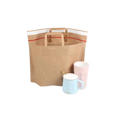 China Recycled Materials Wholesale Washable Logo Handle Bag For Shopping Custom Kraft Paper Bag for sale