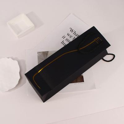 China Recyclable Biodegradable Printing Customized Logo Recycle Black Gift Handle Kraft Paper Drawstring Packaging Bag For Wine Bottle for sale