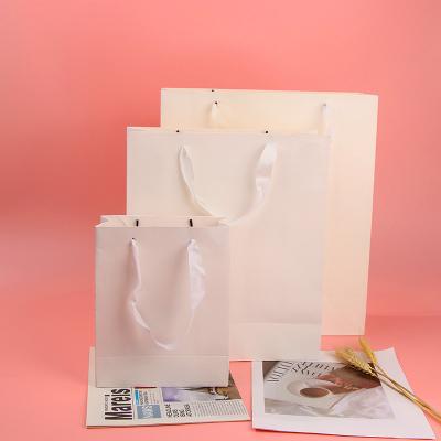 China OEM ODM Printing Logo Recyclable Biodegradable Custom Logo White Paper Gift Ribbon Handle Package Bag For Purchasing for sale