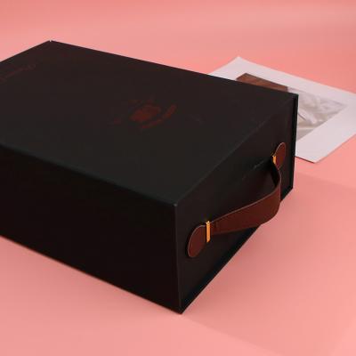 China Recycled Materials Printing Custom Logo Closure Gift Magnet Paper Box Black Ribbon Handle Collapsible Magnetic Rigid Paper Boxes For Wine Bottle for sale