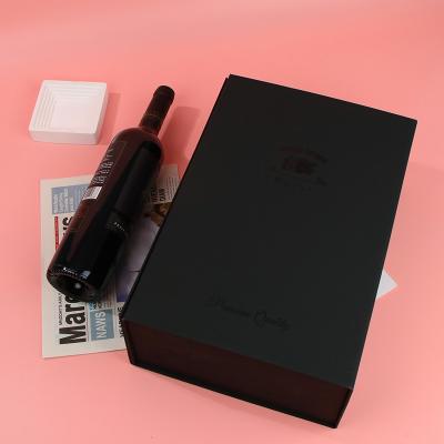 China Recycled Materials Wholesale Rigid Magnetic Collapsible Black Magnet Boxes Closure Paper Gift Packaging Boxes With Ribbon Handle For Wine Bottle for sale