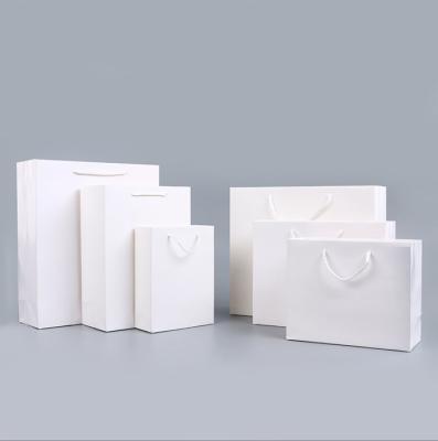 China Recycled Materials China Manufacturer White Luxury Printed Custom Gift Shopping Paper Bag With Your Own Logo for sale