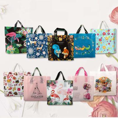 China 50pcs Recyclable High Quality Flower PE Gift Plastic Shopping Apparel Package Bags For Party Supply Christmas New Year for sale