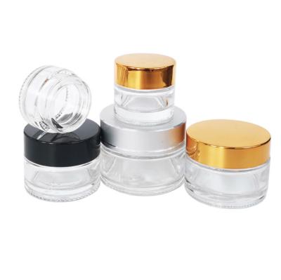 China wholesale skin care cream frosted glass jars and clear glass cosmetic jar bottles with lids for sale