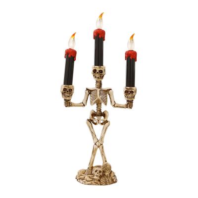 China Halloween Supplies New Product Ideas 2022 Epoxy Resin Three Skull Candles Led Light For Halloween Decoration for sale