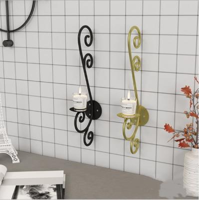 China Wholesale Home Decoration Black Gold Wall Hanging Metal Iron Luxury Candle Holder For Home Decor for sale